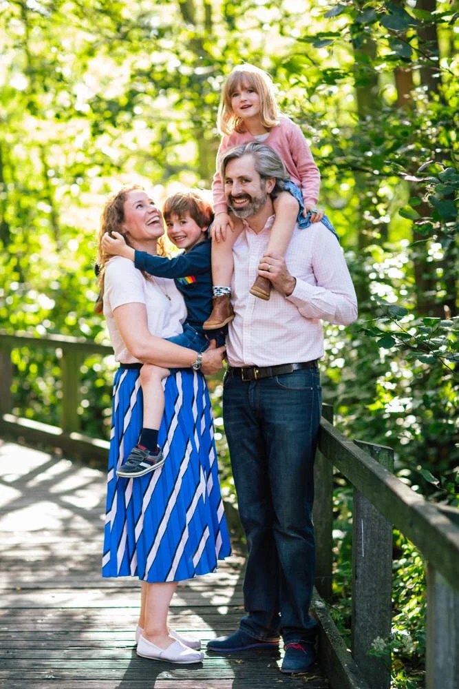 * Natural, unposed family photo among the trees on Wandsworth Common, South West London