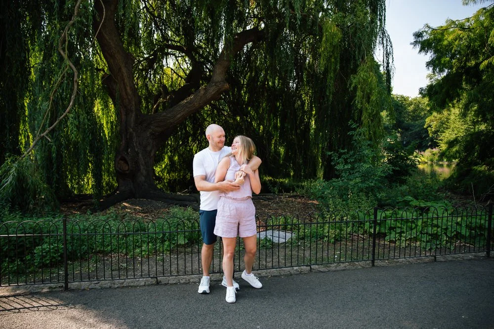 Newly engaged couple hug after romantic st james's park proposal photoshoot