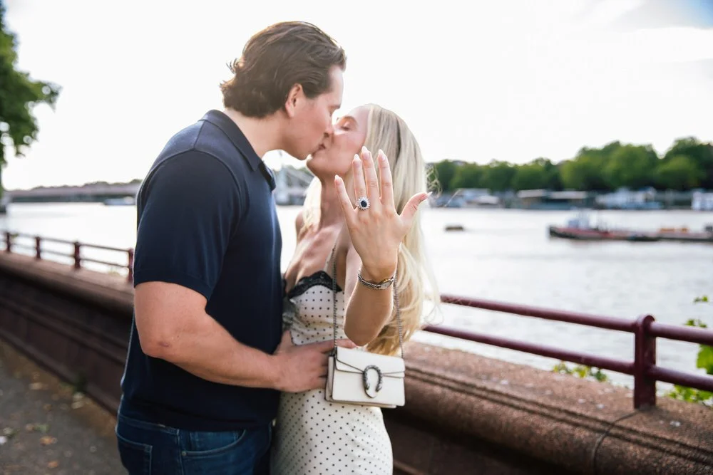Couple kiss near Albert Bridge after a secret Battersea park proposal photoshoot