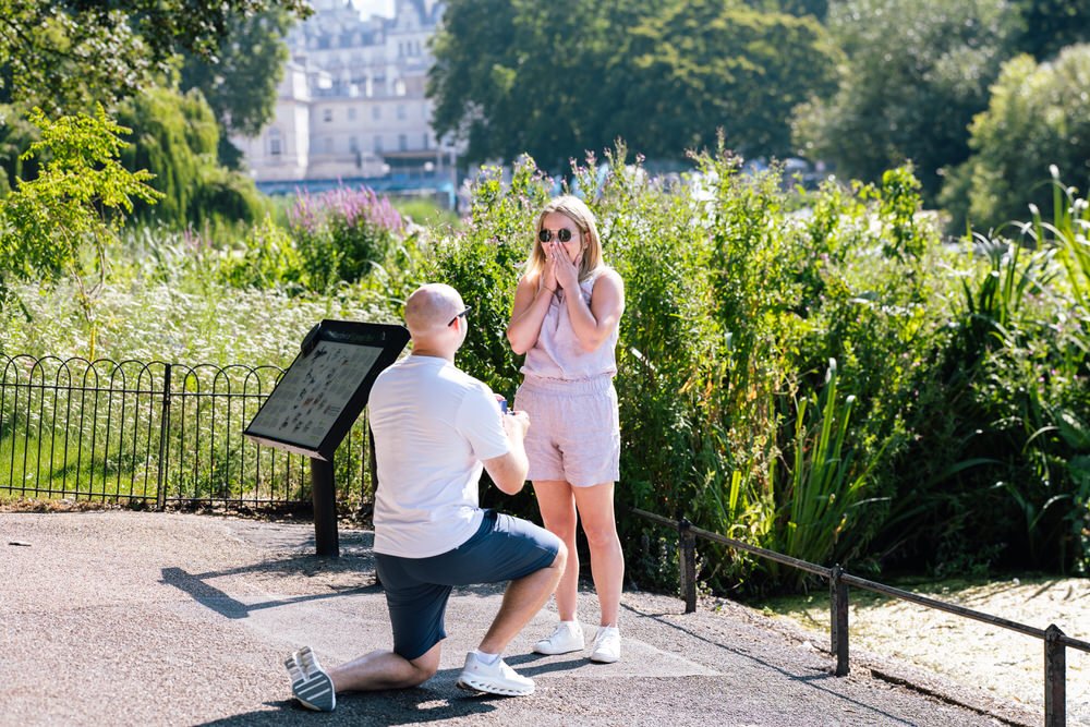 Man is down on one knee in St James's Park for romantic secret proposal photoshoot