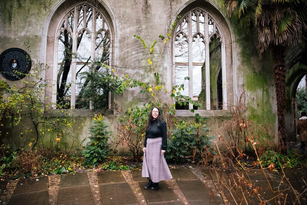 Young lady infront of St Dunstan in the East ruins during winter solo traveller photoshoot