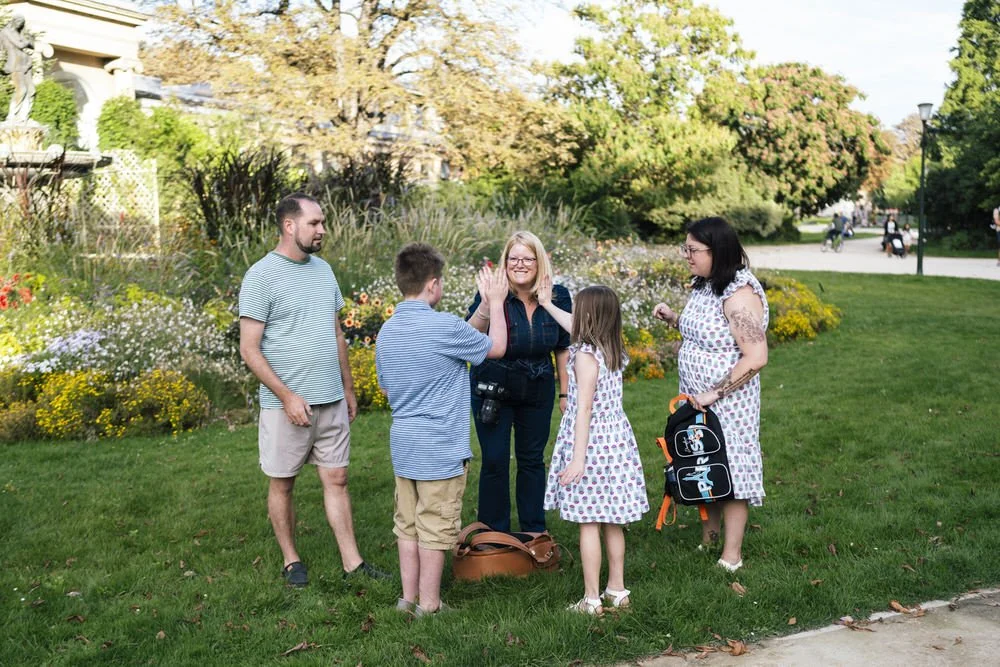 Kirsty Hamilton Photography Business Mentor high fives family after photoshoot