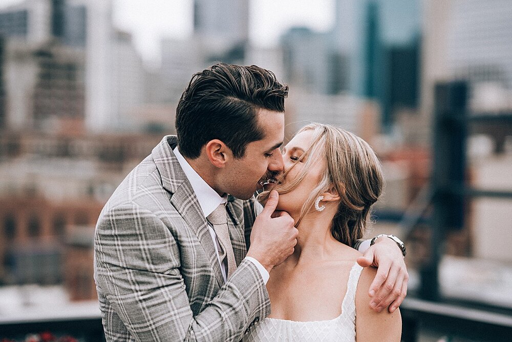 couple-kissing-on-hewing-hotel-rooftop.jpg