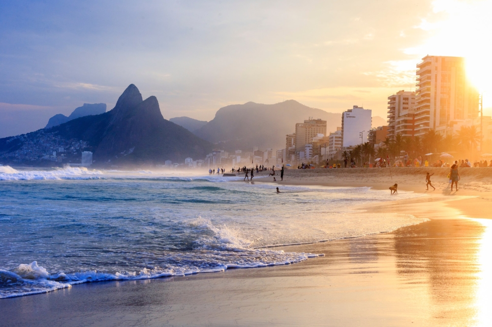 Ipanema Sunset - the Images that started this collection. Notice the left side of the image, where the favela lays on top of the mountain, being cast by a blue shade while the right hand side shows one of the most iconic and expensive places in Rio de Janeiro.