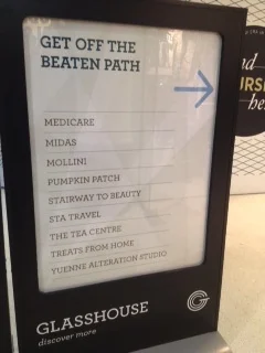 (This image shows that this government Medicare office is within a mall, alongside stores and cafes.)