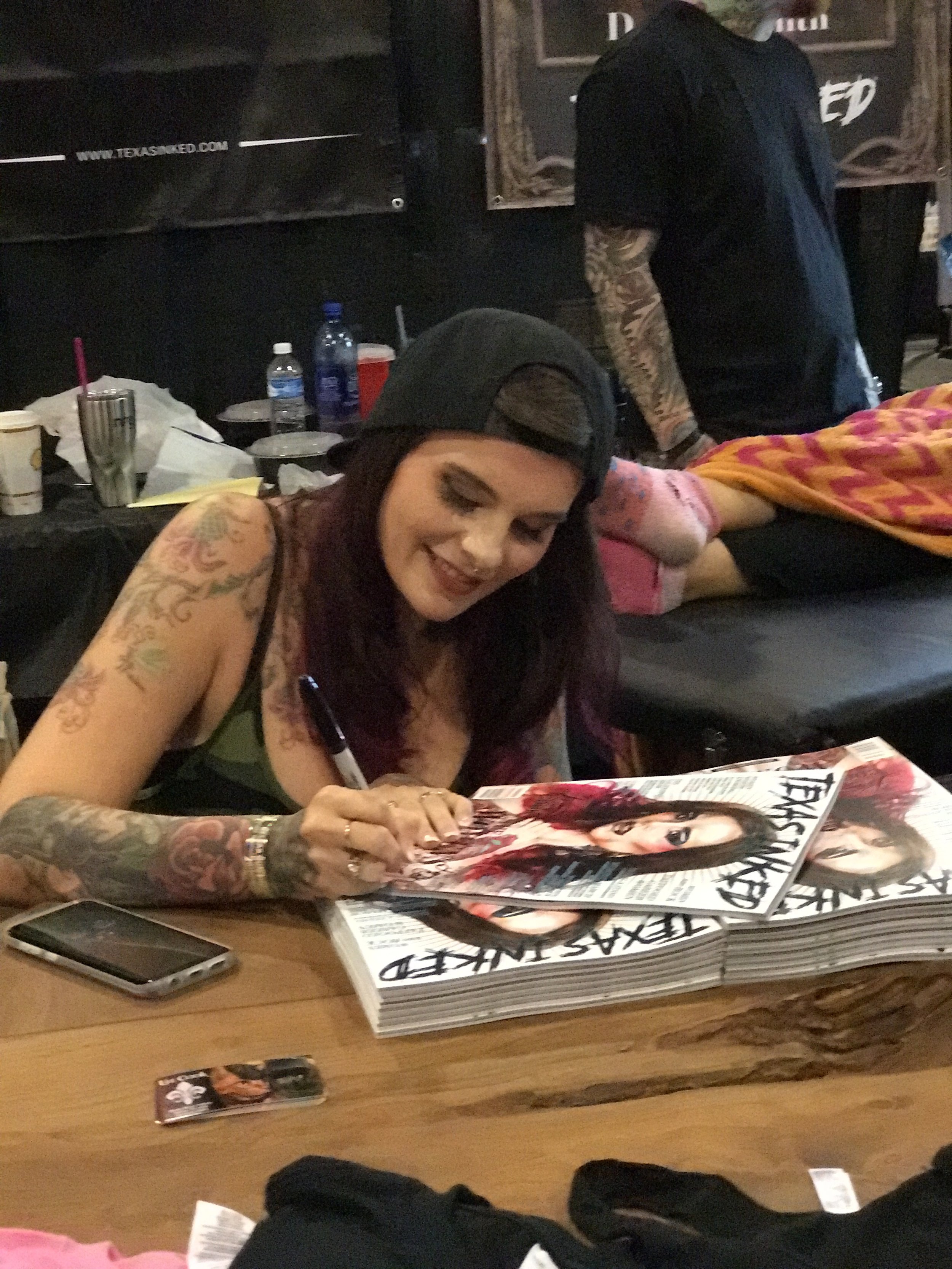  Our cover girl,  Liz Cook  signing some magazine. 