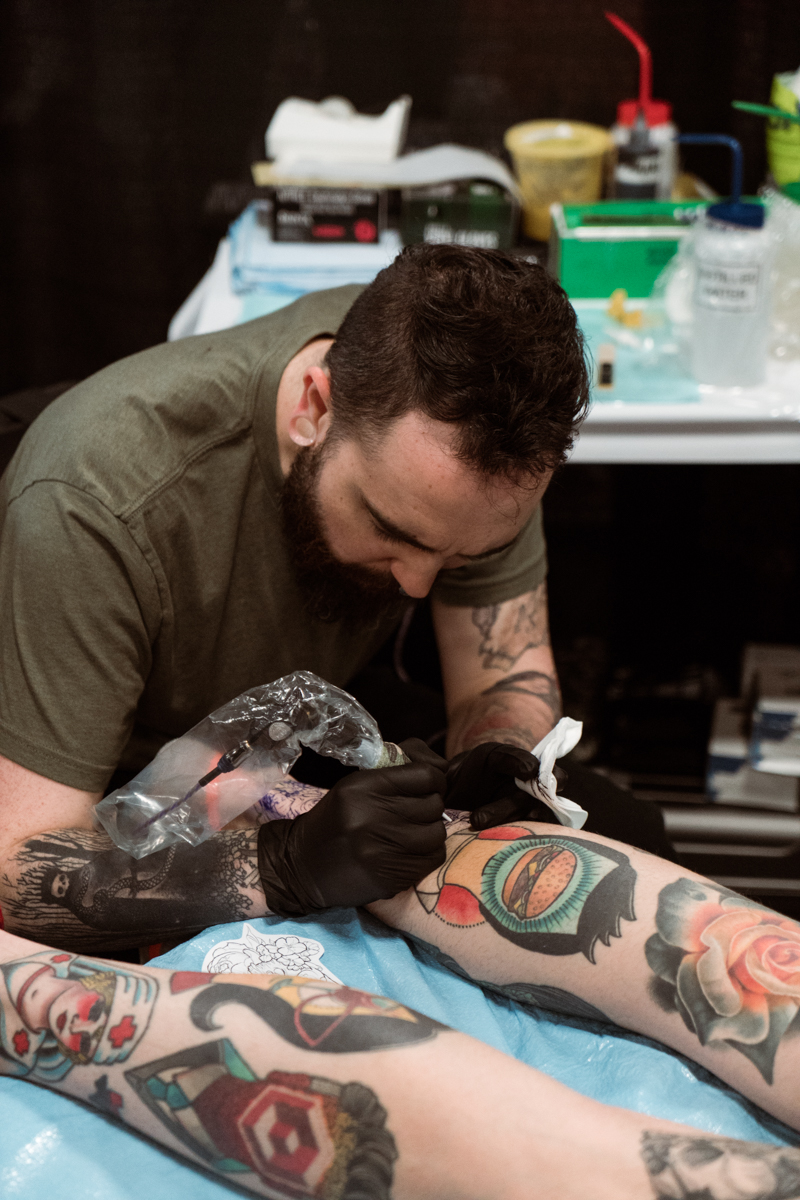  David Poe working hard on a new tattoo right below a faceless masterpiece by Jay Joree. That's a very lucky leg. Find David at Moon Tattoo Studio in Austin. 