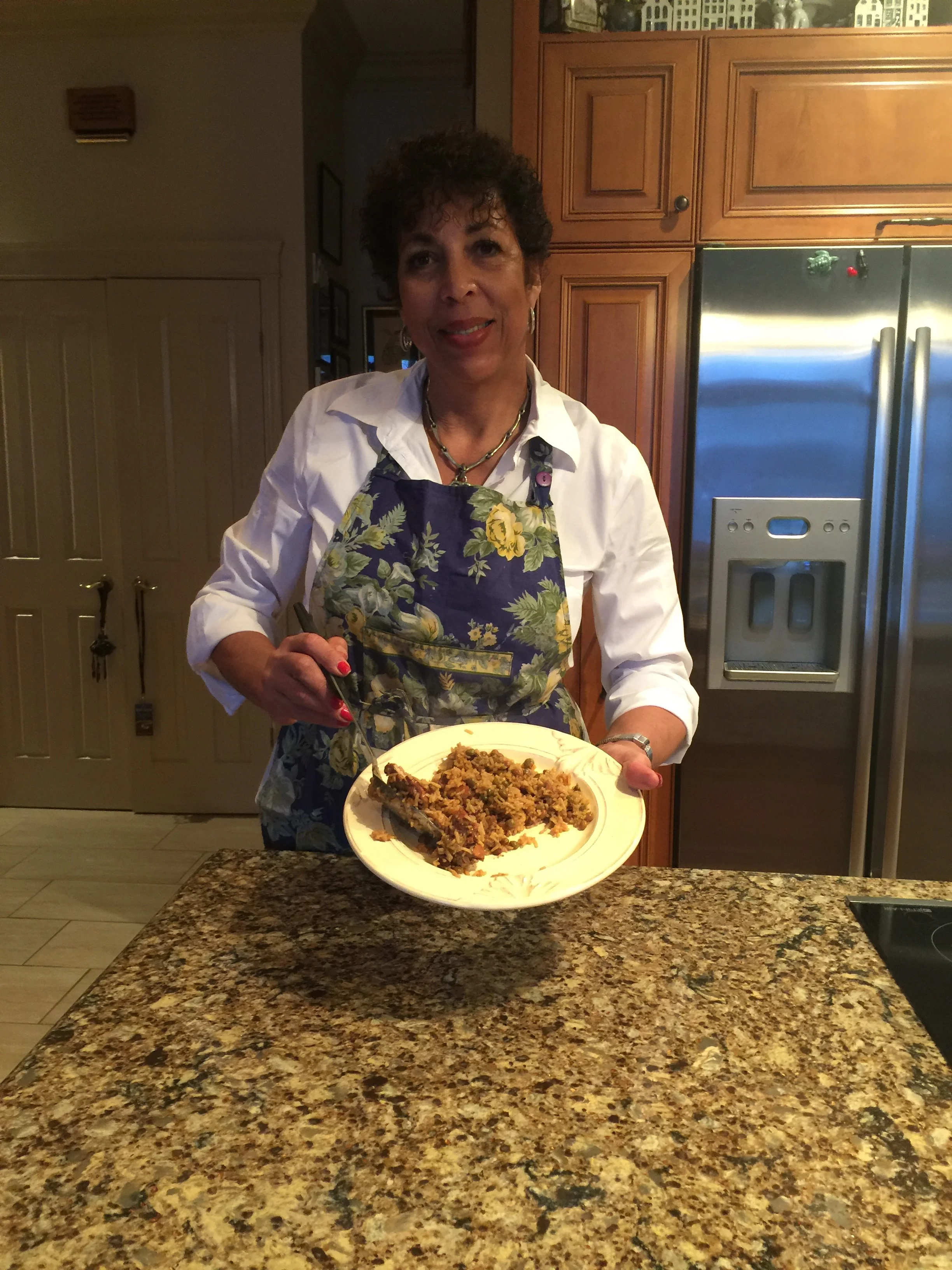 Inga Crooke Lawson in her Vaudreuil-Dorion kitchen serves up Trinidad Pelau