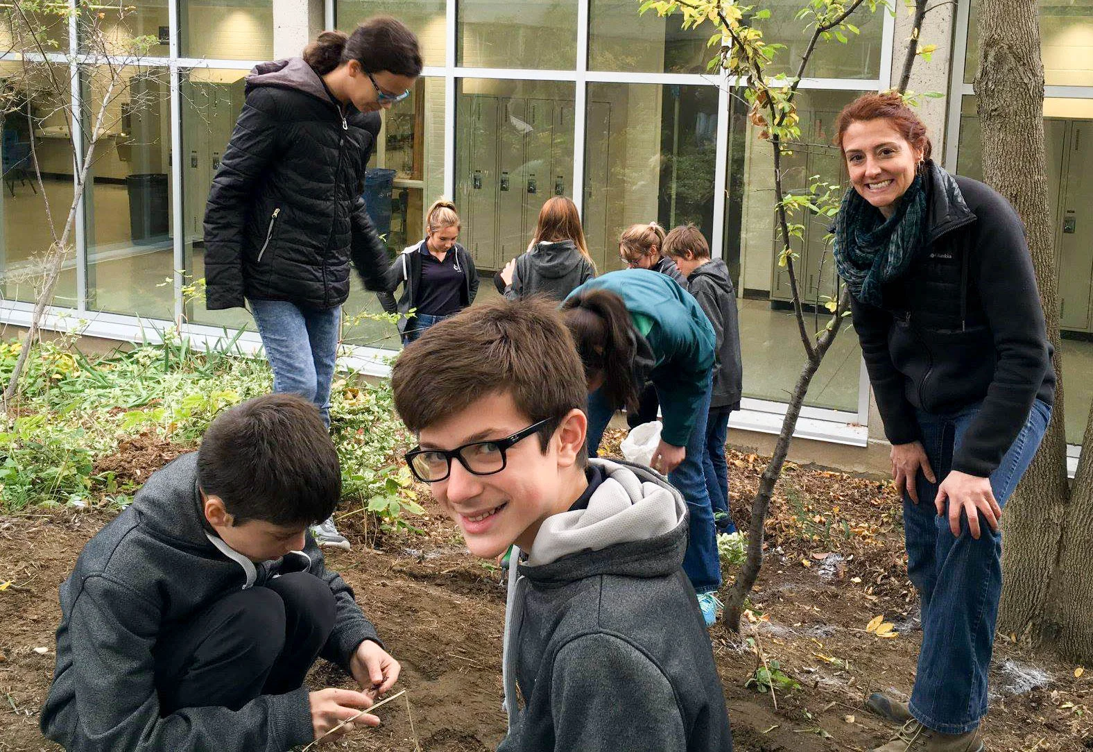 Katryne and ESCJ Students Planting Bulbs.jpg