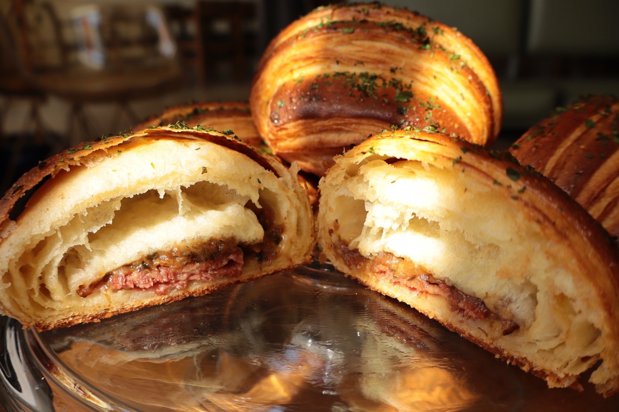 FRESH SPECIAL IN THE CASE: CORNED BEEF CROISSANT 

It is March, dear reader, and time for Spring happenings. So, let us celebrate everything that is the Corned Beef Croissant. House corned beef, caramelized cabbage, and Irish cheddar all tucked insid