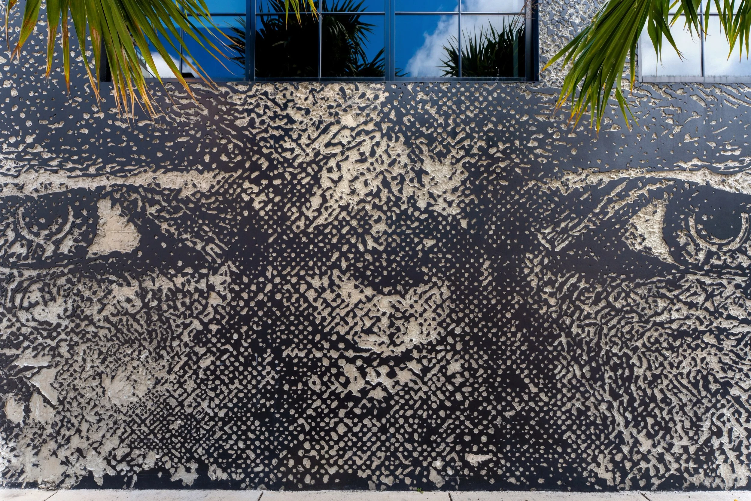 03-vhils-carved-concrete-facade.jpg