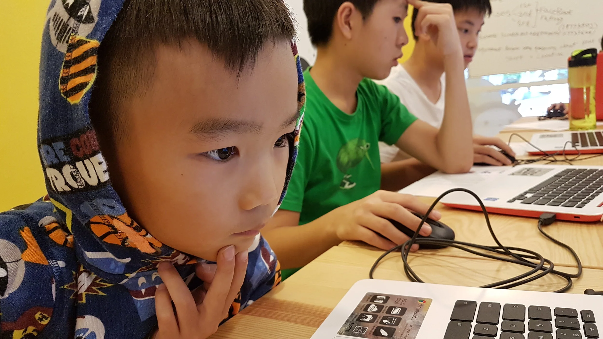 Noah, age 9, learning to code at our trial class