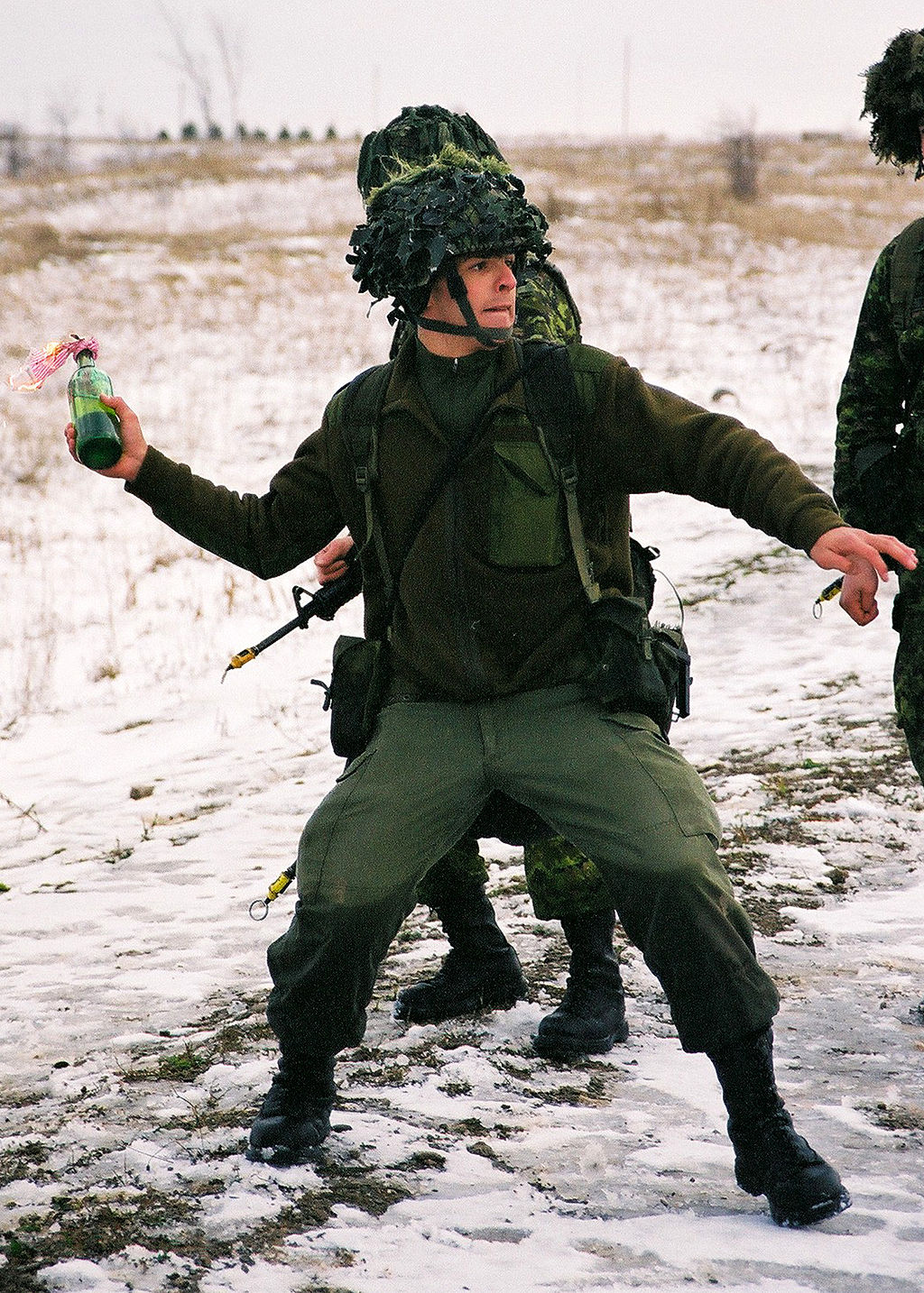 Canadian soldier throwing a Molotov cocktail