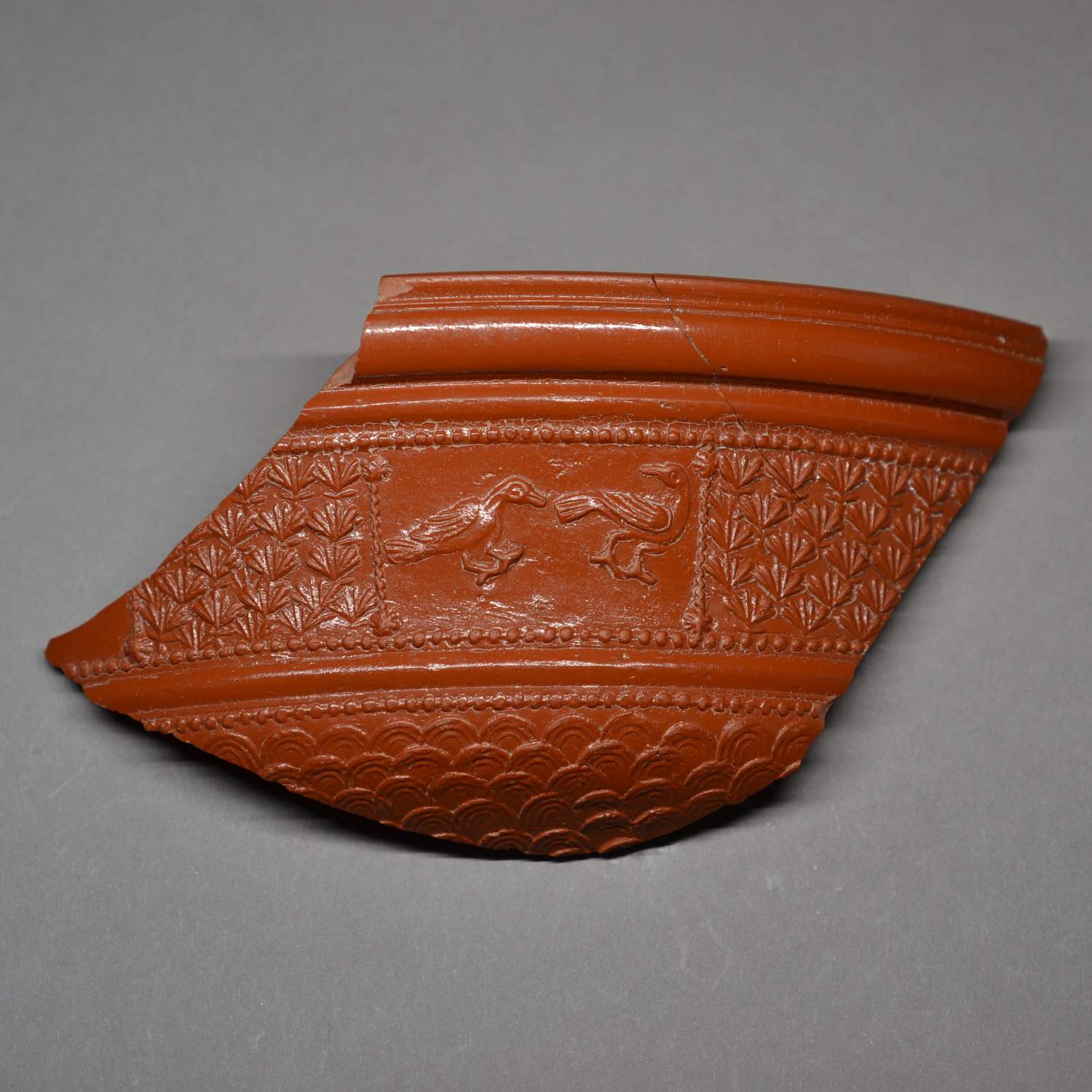 LARGE FRAGMENT OF A ROMAN SAMIAN WARE BOWL.