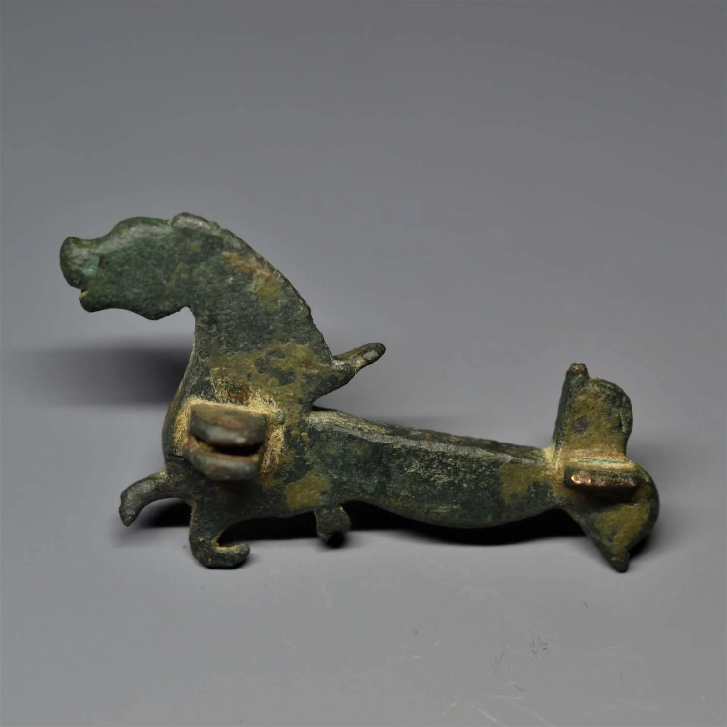 ROMAN ENAMELLED ZOOMORPHIC HIPPOCAMPUS BROOCH. — FELICITAS.PERPETUA