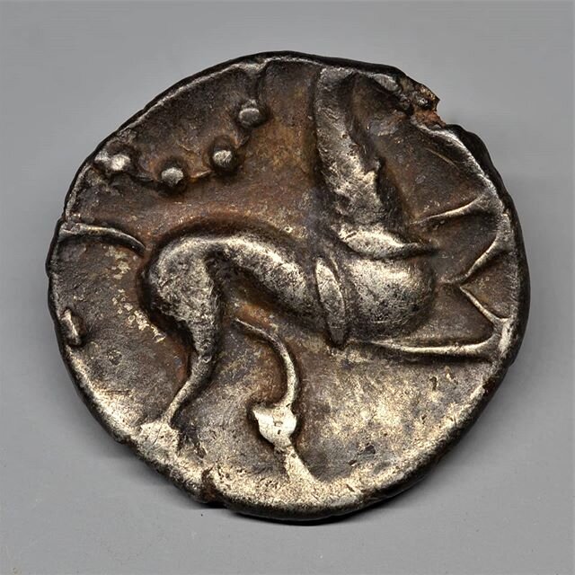 A beautiful Celtic silver coin of the Corieltauvi tribe. On the obverse an elegantly abstracted horse gallops under a silver beaded moon. The reverse is dominated by a monstrous boar with elongated legs. This enigmatic type was struck in Lincolnshire