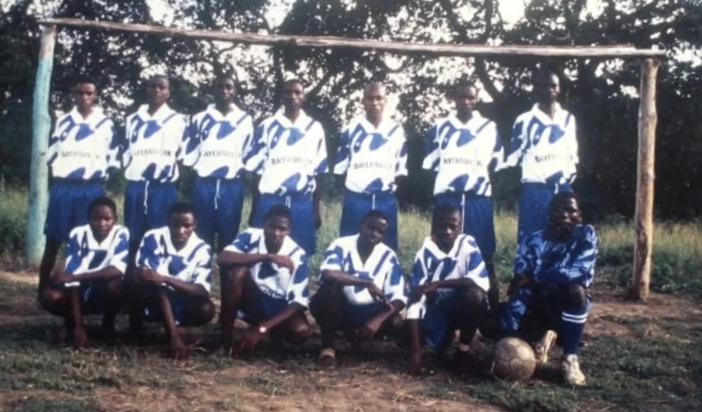 Before the incident, Arnold with his football team. He is on the standing row, second from the left