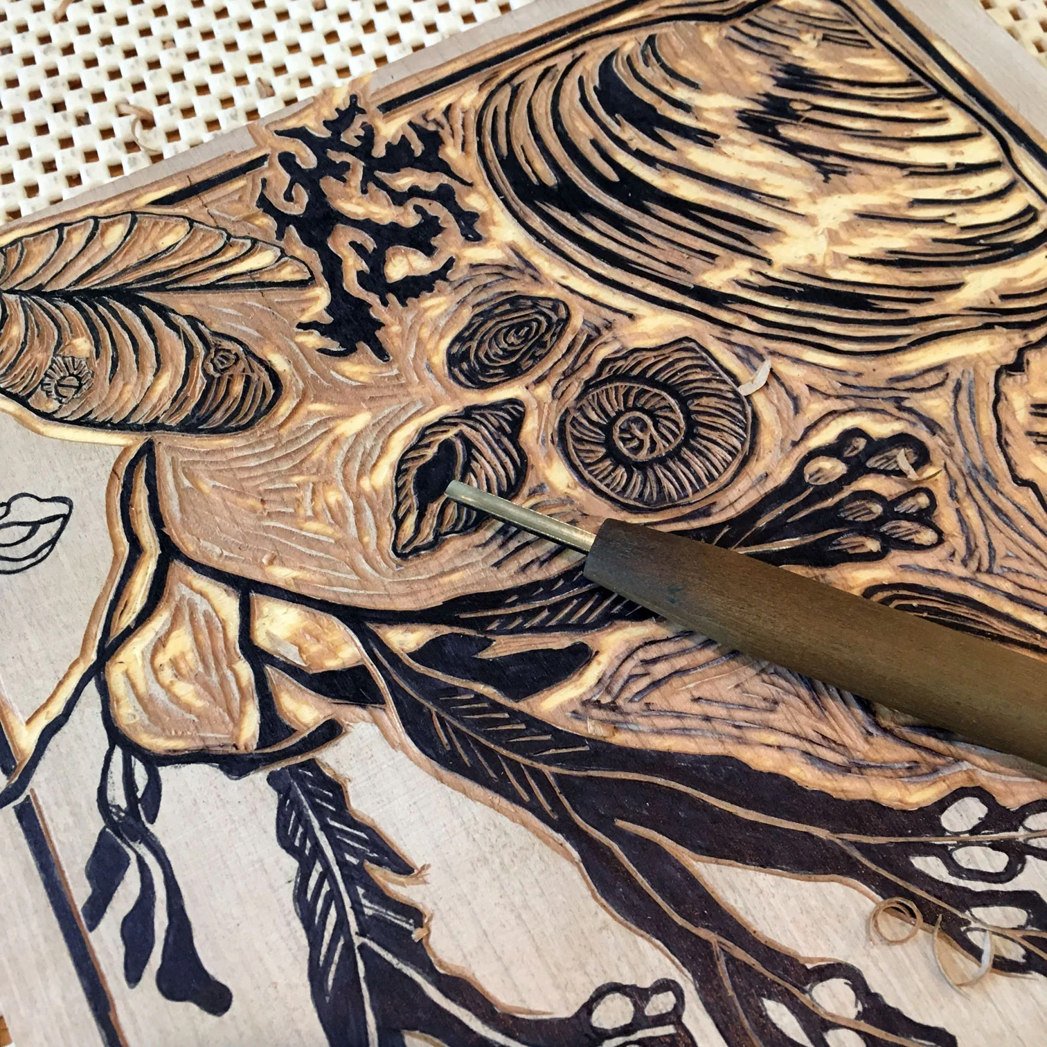 Cutting a one-color woodblock.