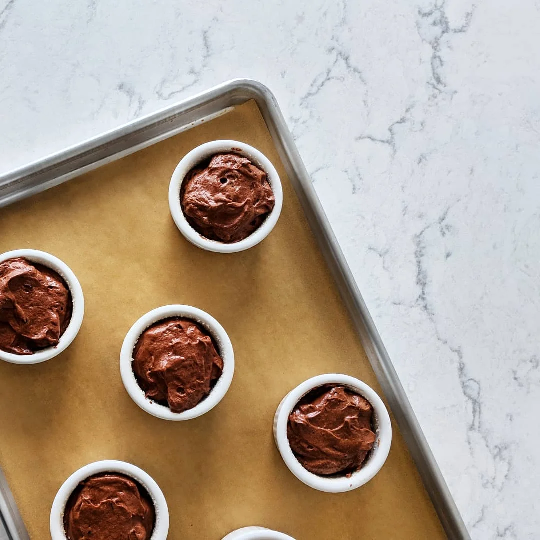 These were filled with an ice cream scoop and yielded a more “rustic” appearance, but a way to get cleaner tops is to use a piping tip fitted with a large round tip.