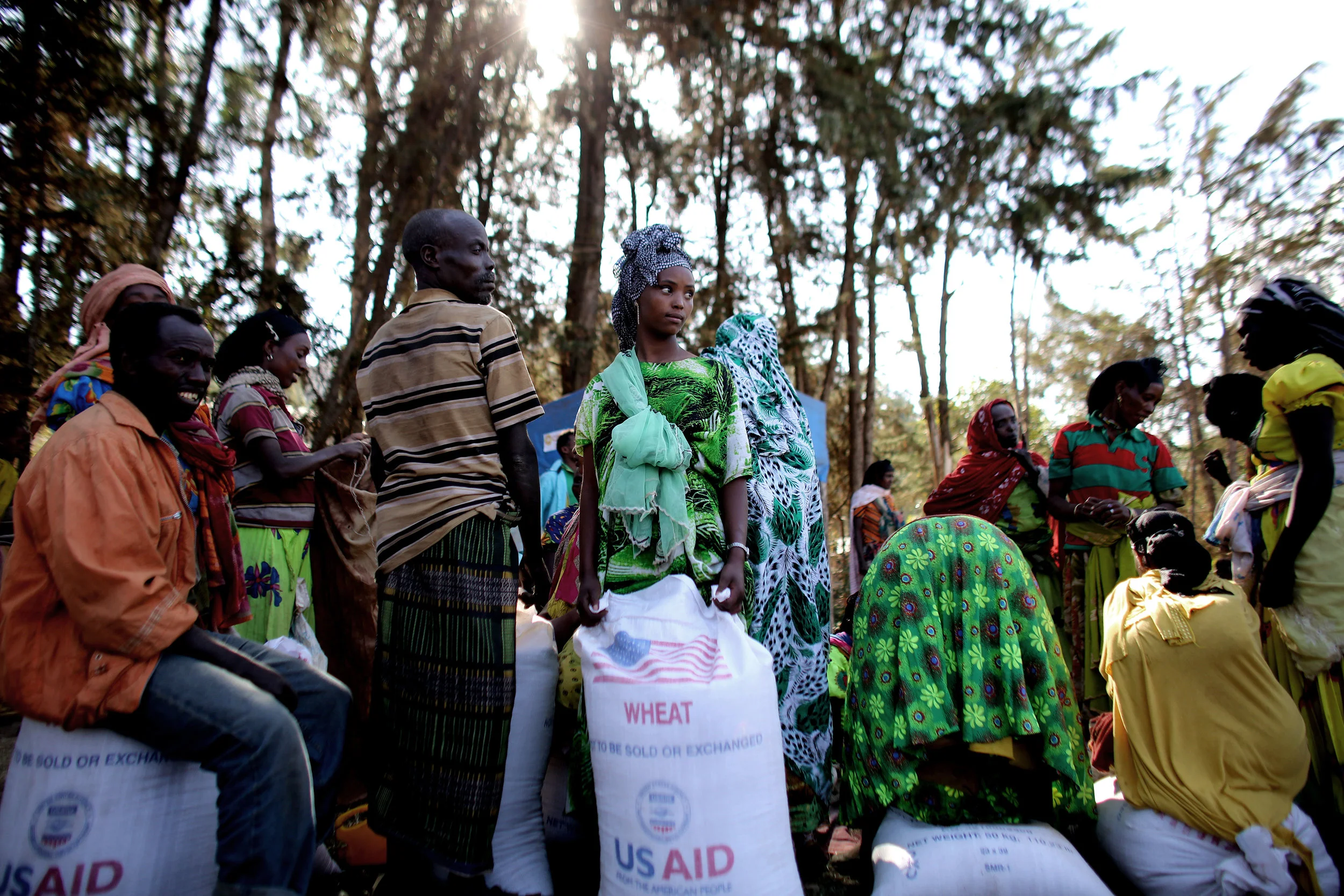 Food aid is divided up among women in drought stricken region of Ethiopia.