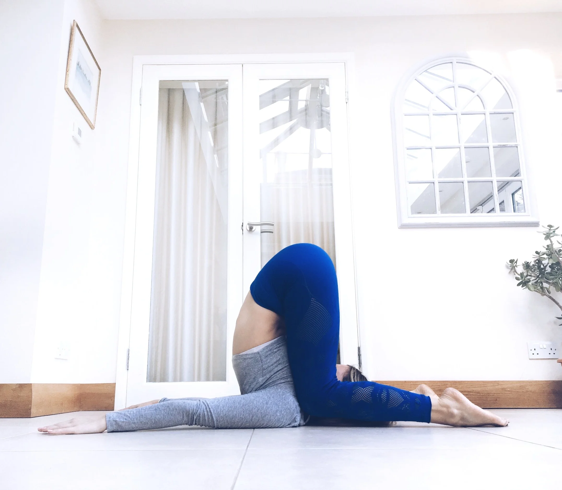 Karnapidasana. Knee to Ear Pose.