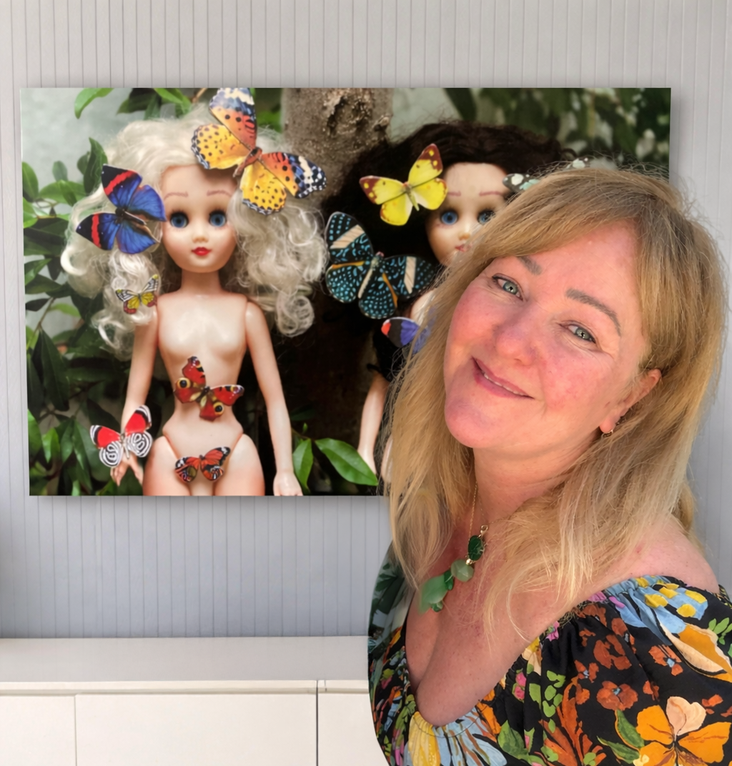 Julia Gomelsky standing in front of "Butterflies" canvas