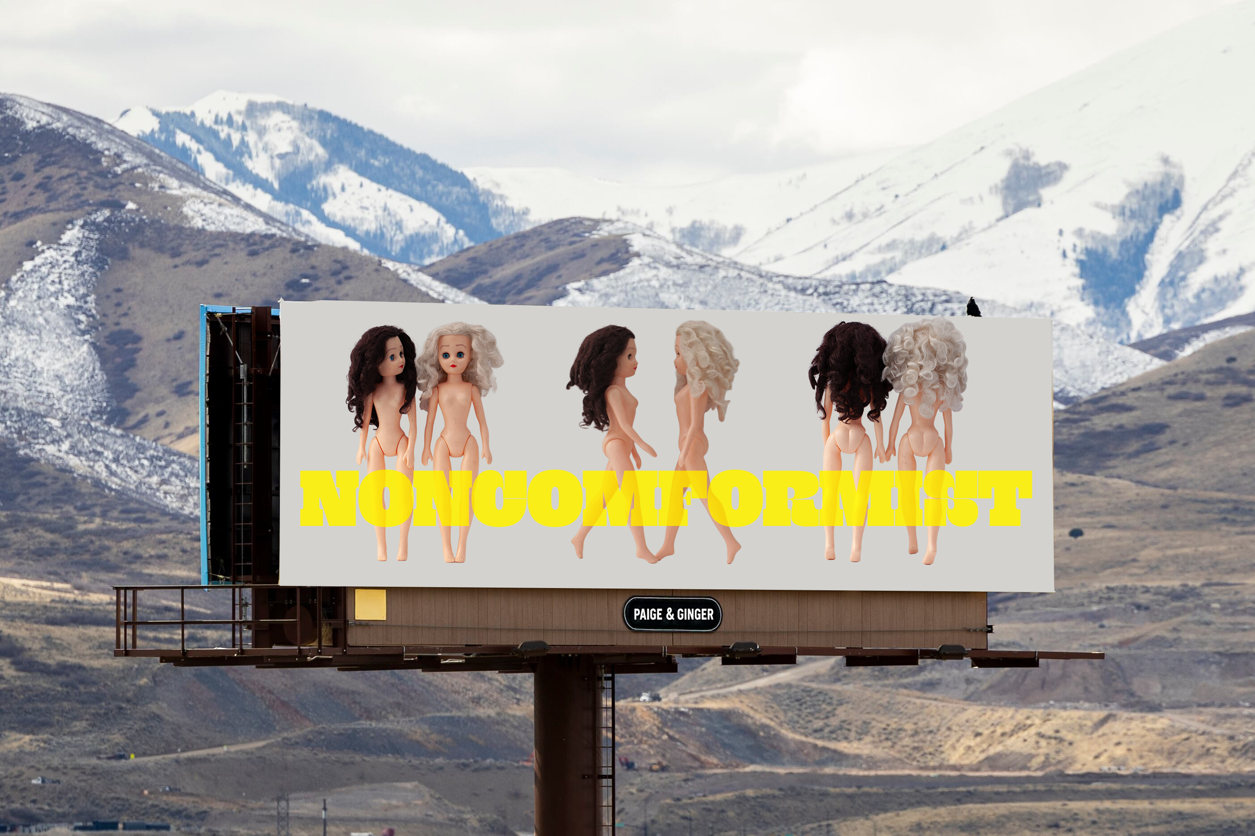 Billboard of Paige and Ginger images on a blank wall with the words NONCOMFORMIST written across the sign in bright yellow in a setting with the snow capped mountains in the background