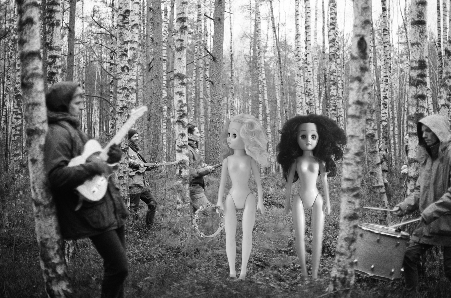 Paige and Ginger in a forest with people playing musical instruments