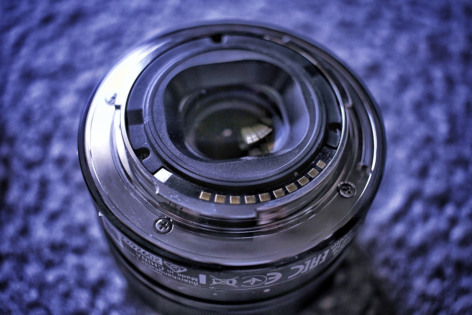 The metal lens mount is held on by 4 small screws.