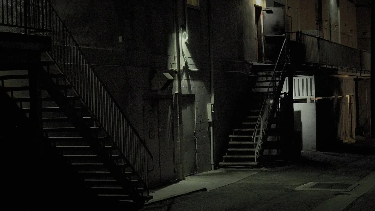 I'm a scout. Moving through shadows and light at night, I find good spots for video & movies.
The light is already there. 
It's a real place but for "make believe". 
-Digital Ninja®