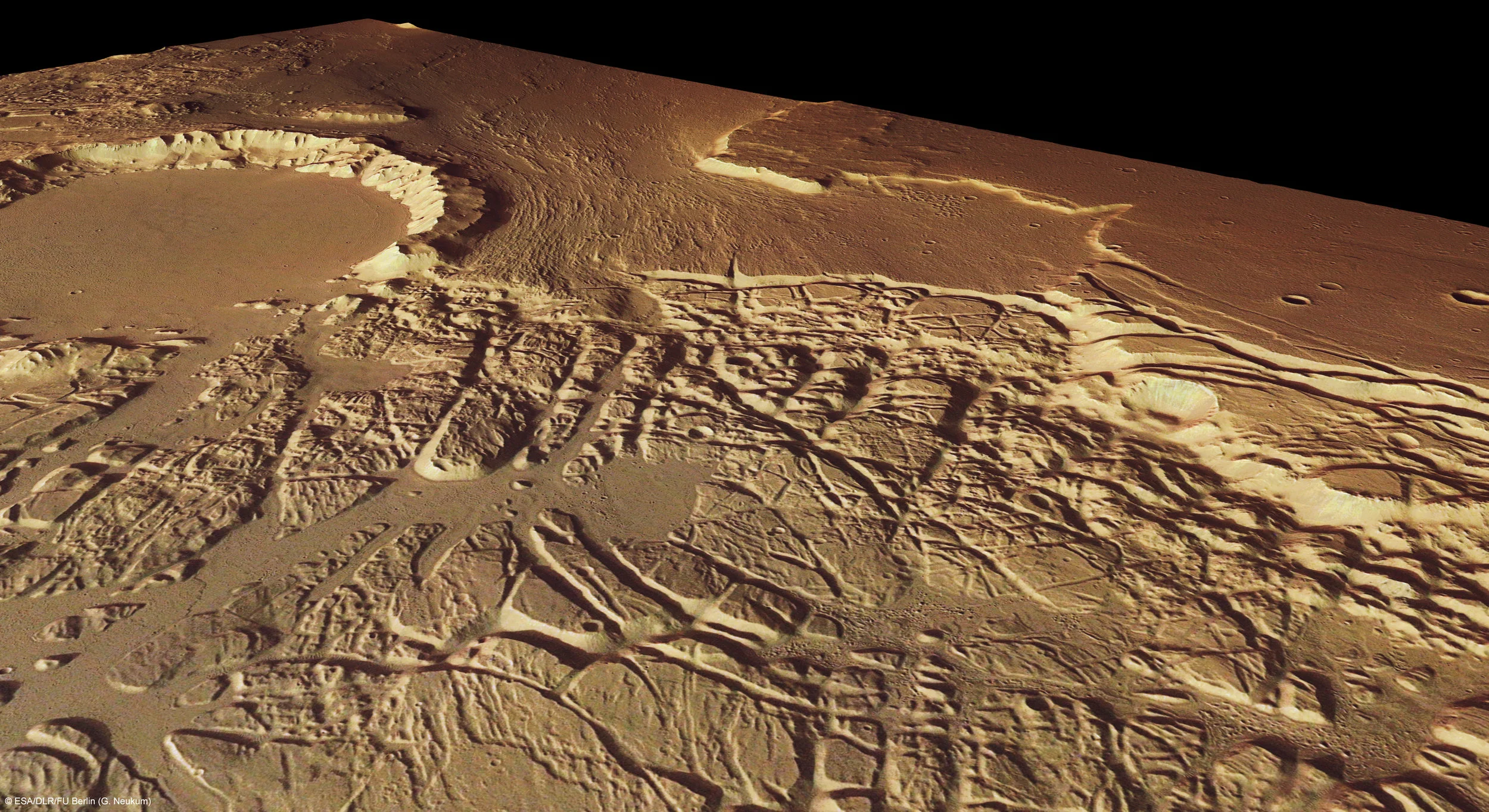 This image shows chaos terrain between Kasei Valles and Sacra Fossae. That crater is 35 km across, and is believed to have been breached by flowing water sourced up from beneath Echus Chasma some 850 km southwest of this area. We discussed this region above when we looked at Kasei Valles. Something worth noting; if we look at the top half of the photo, and compare it to the lower half where the terrain is chaotic, we see an obvious difference as if the upper half were still buried in sediment, and the lower half that sediment was washed away exposing the terrain below. I don't usually know what I'm talking about, I merely try to stand on the shoulders of giants, but perhaps a detailed mapping of Mars sub surface could reveal missing links that might explain what we see in these regions a little better.