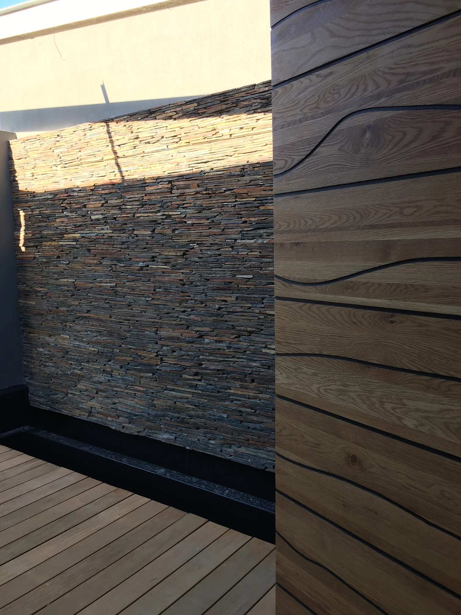  solid oak bespoke front door - entrance bridge &amp; stone clad walls to courtyard. 