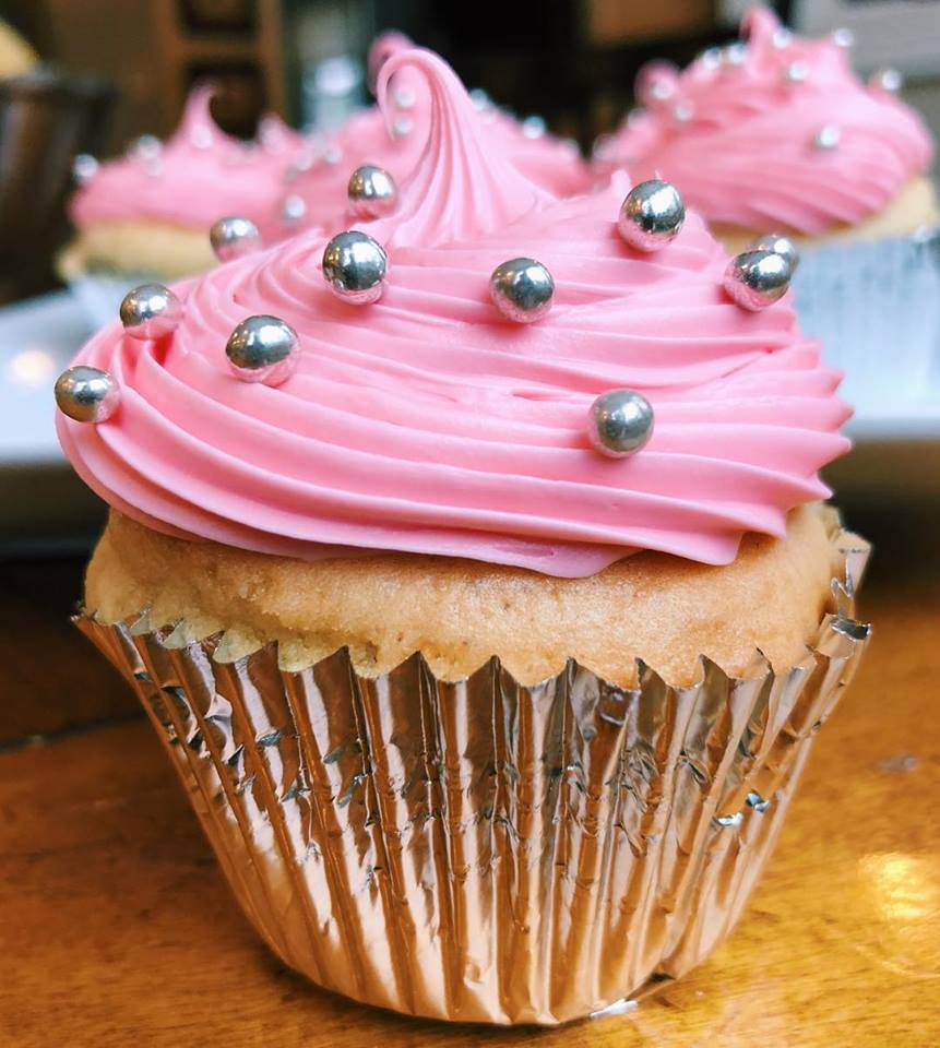 Vanilla cupcakes with pink vanilla buttercream.