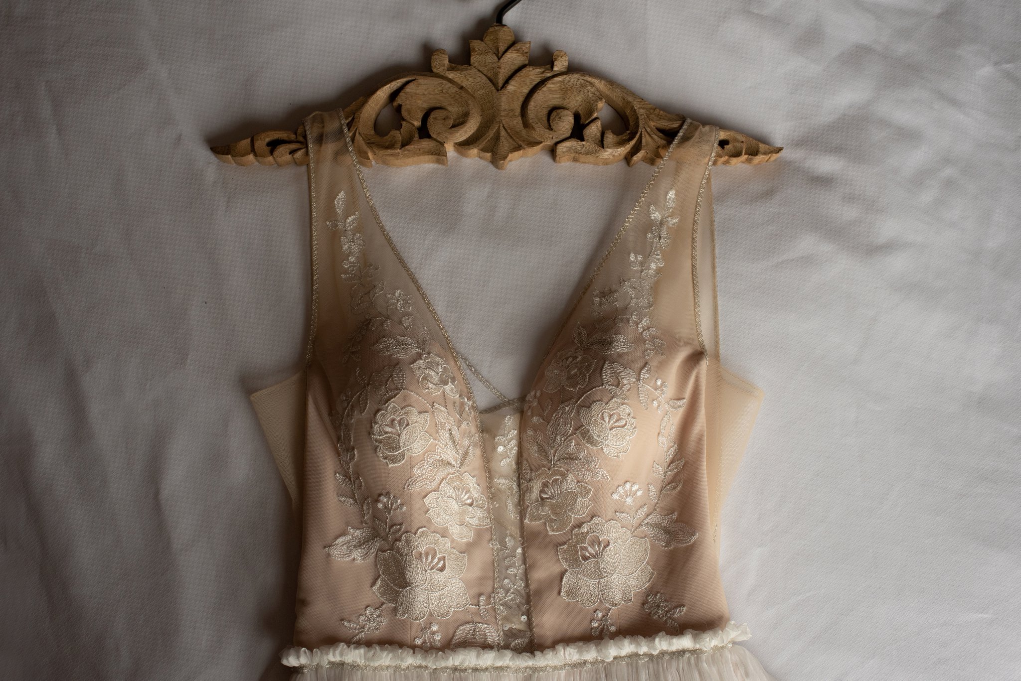 lace wedding dress on boho hangar