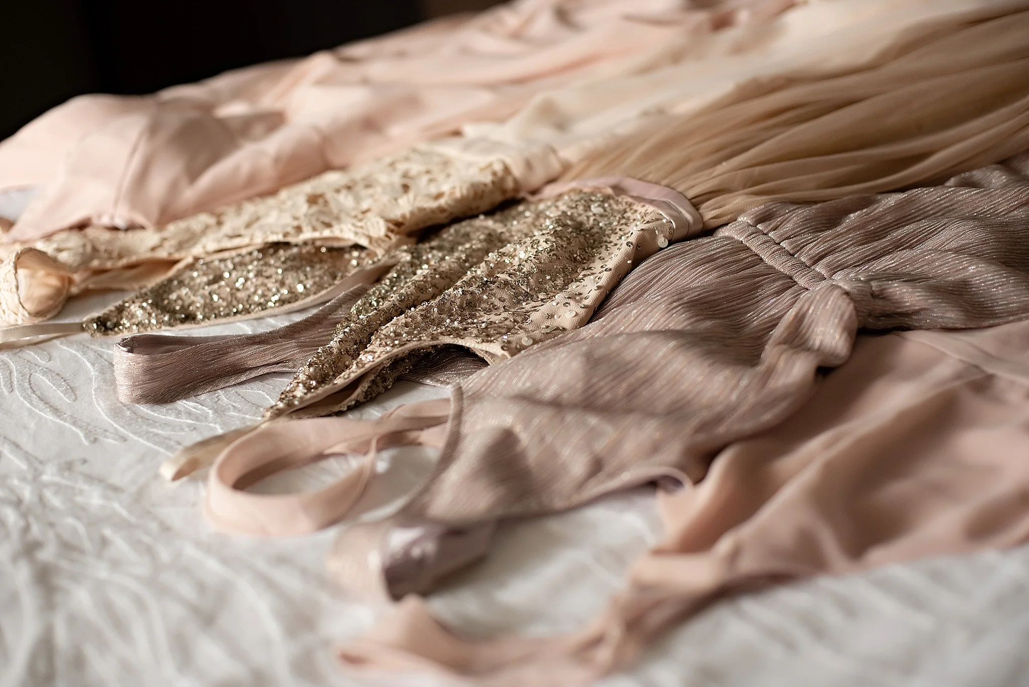 coordinating blush and gold bridesmaids dresses