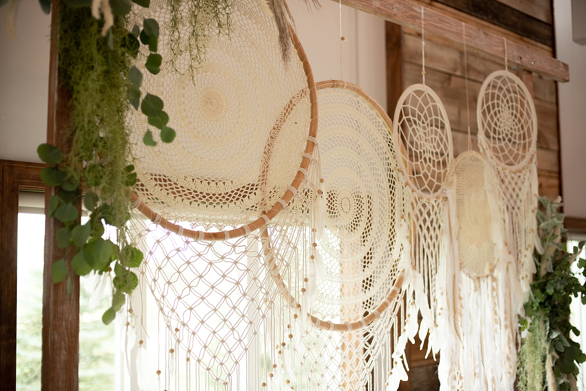 boho dream catchers on wedding arch