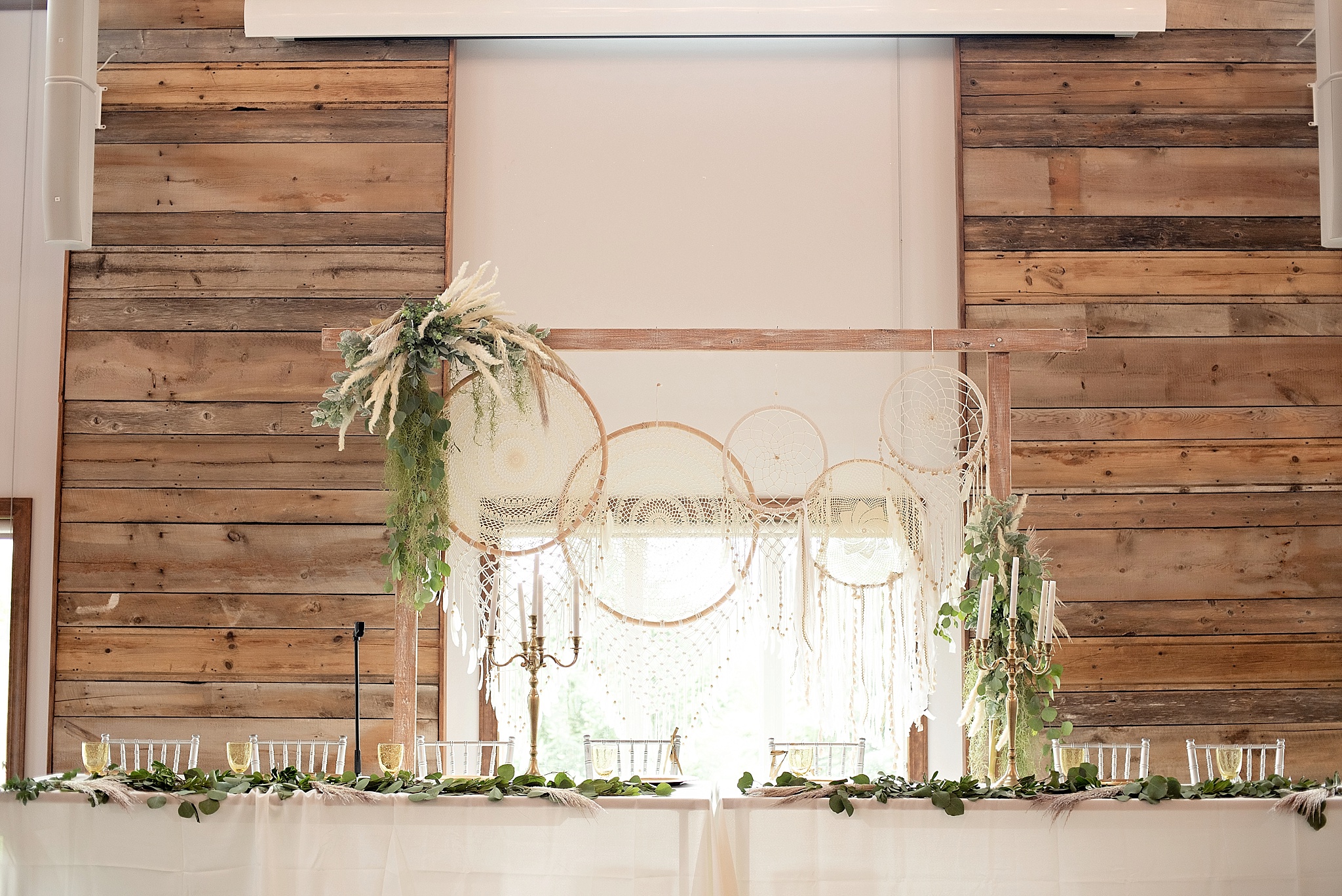 boho dreamcatchers on wedding arch