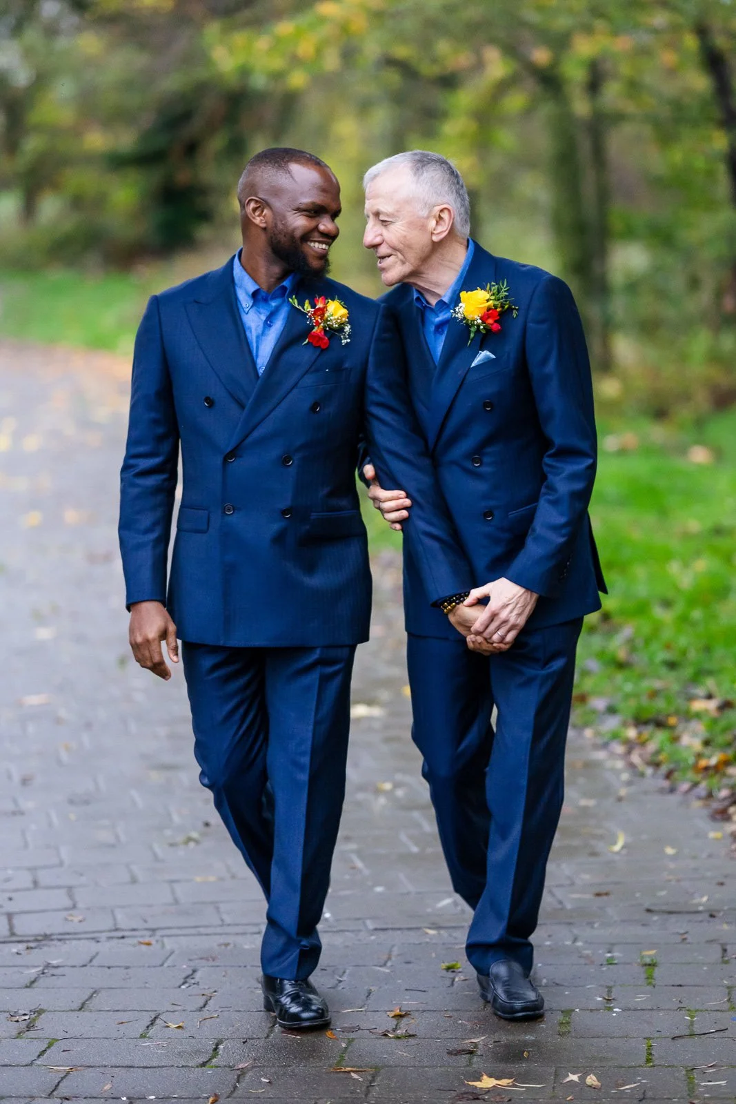 Same sex male couple walking holding hands