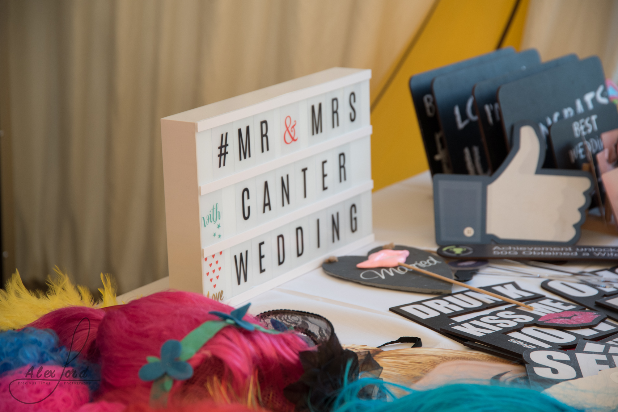 A light box displays Mr and Mrs Canter, on a table with lots of photo props for the wedding guests to use