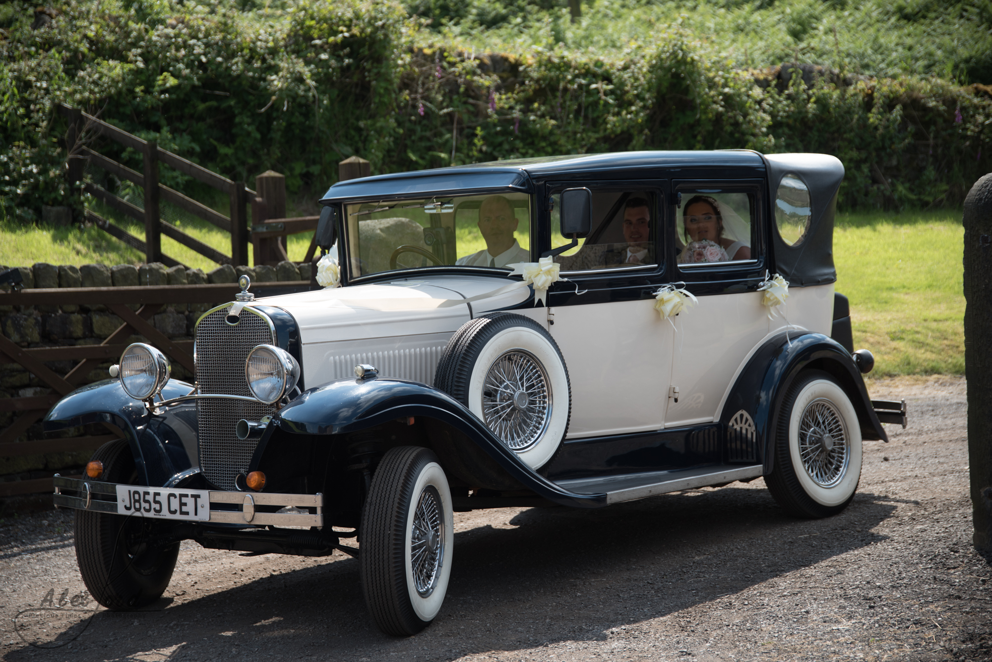 The car arrives at Swancar farm with the bride and groom