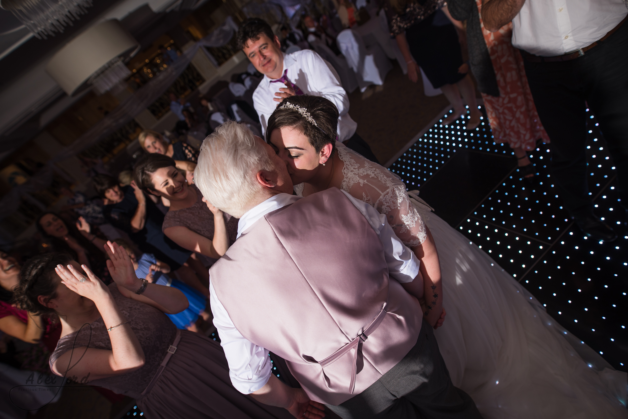 the bride and bride have their first dance together