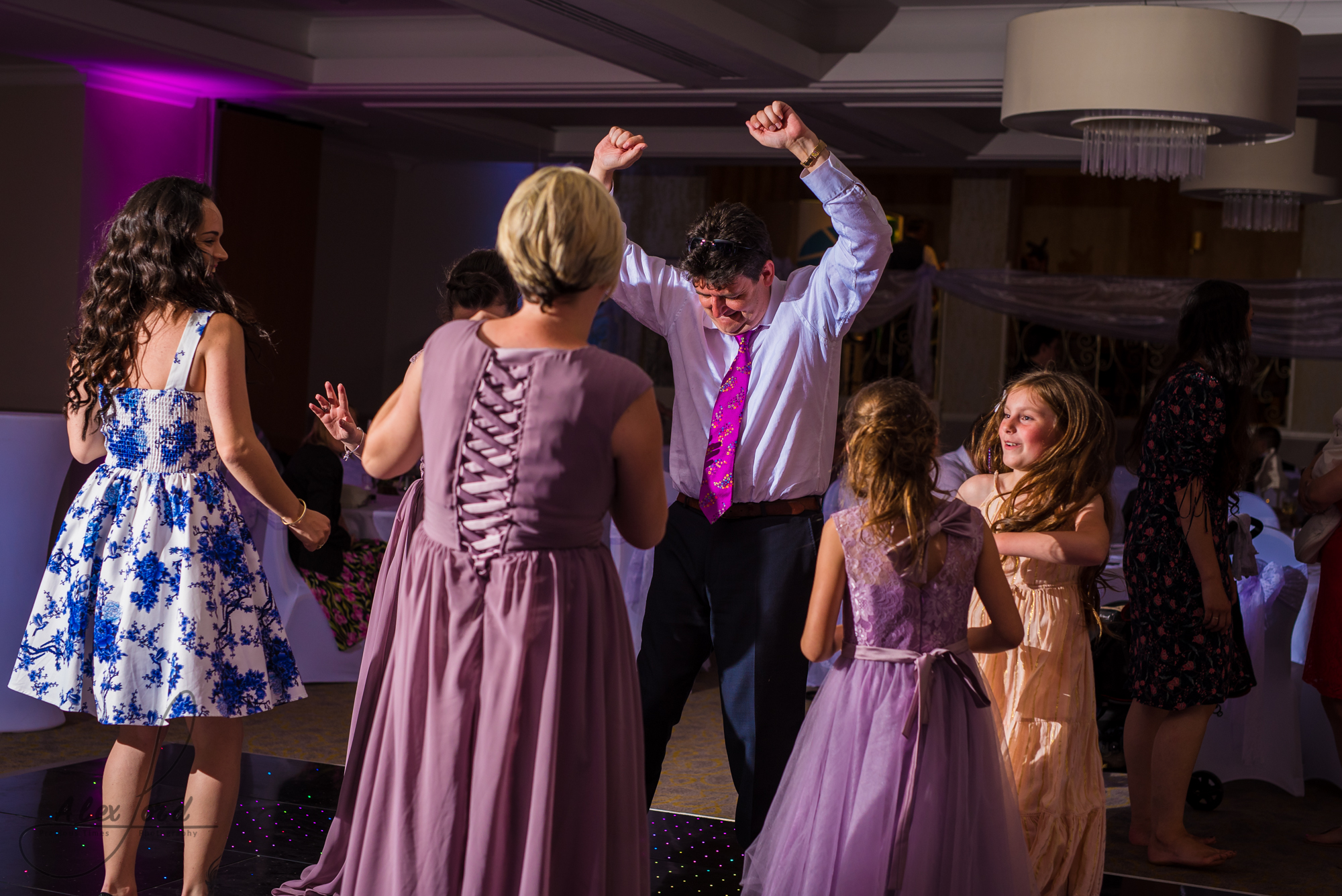 wedding guests dance their legs off on the dance floor before the bride and bride have their first dance