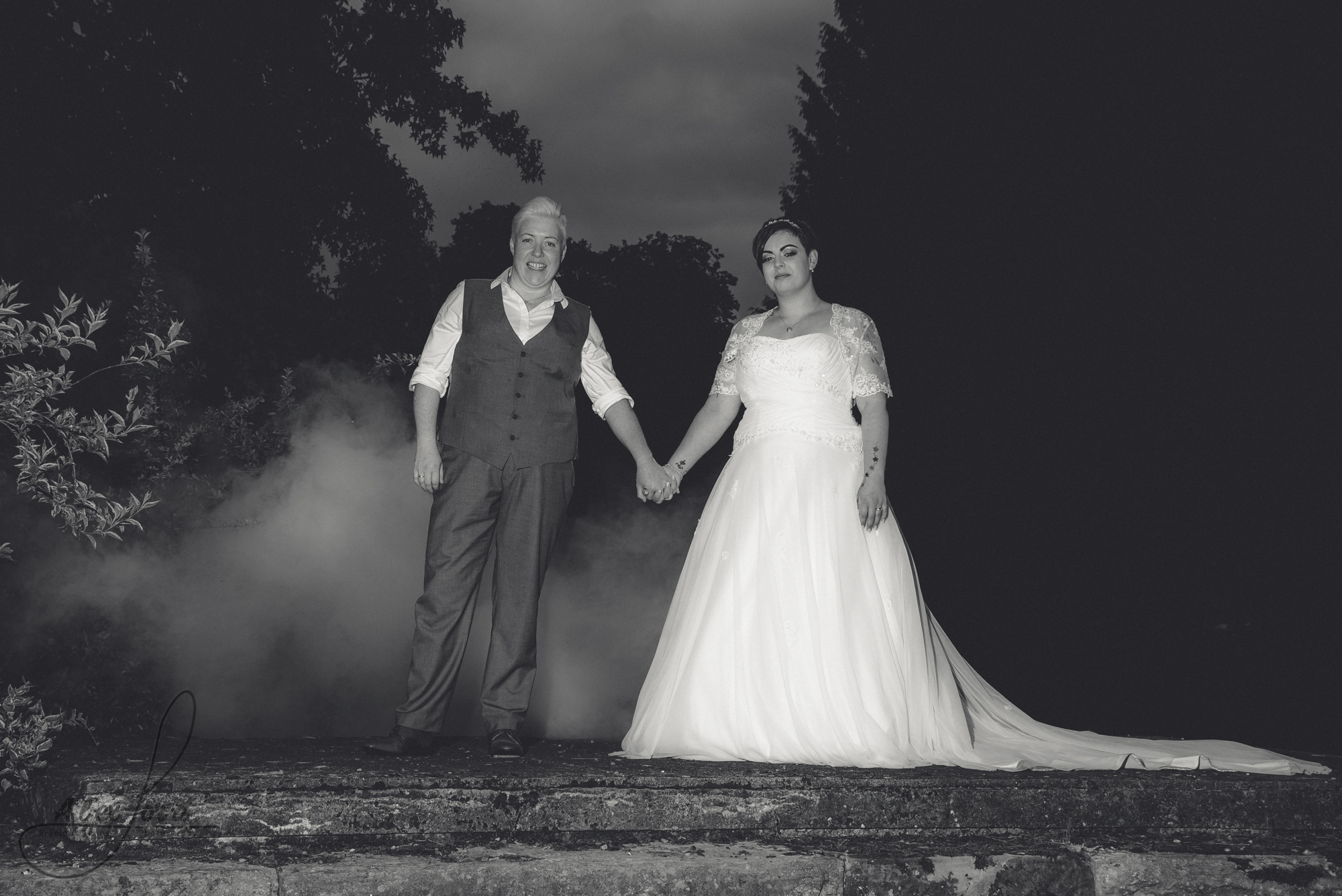 bride and groom have their photo taken with a smoke grenade
