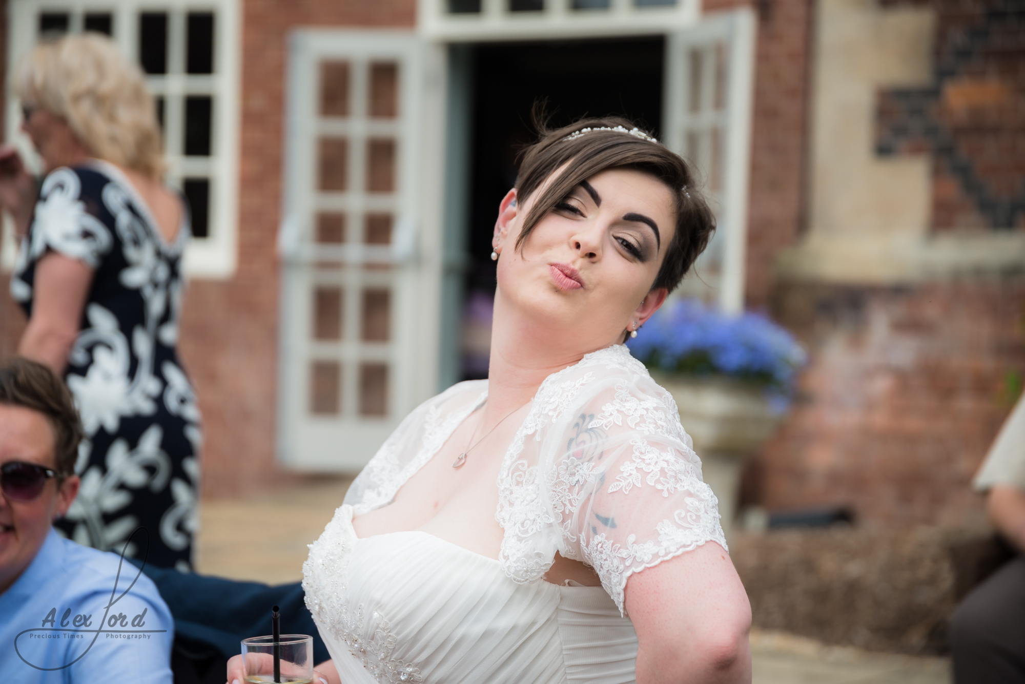 the bride puts directly at the camera outside the wedding venue