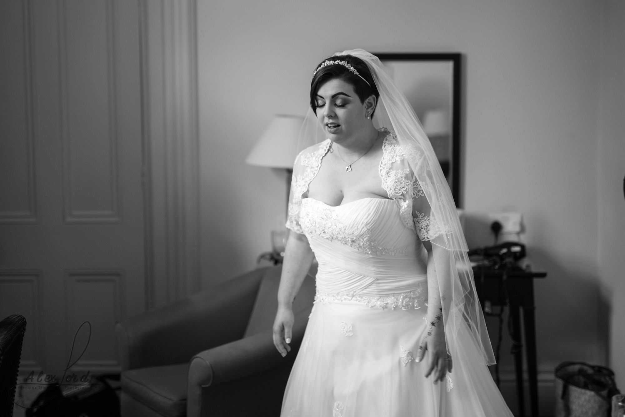 the bride all ready for the wedding ceremony, wearing a lace princess dress