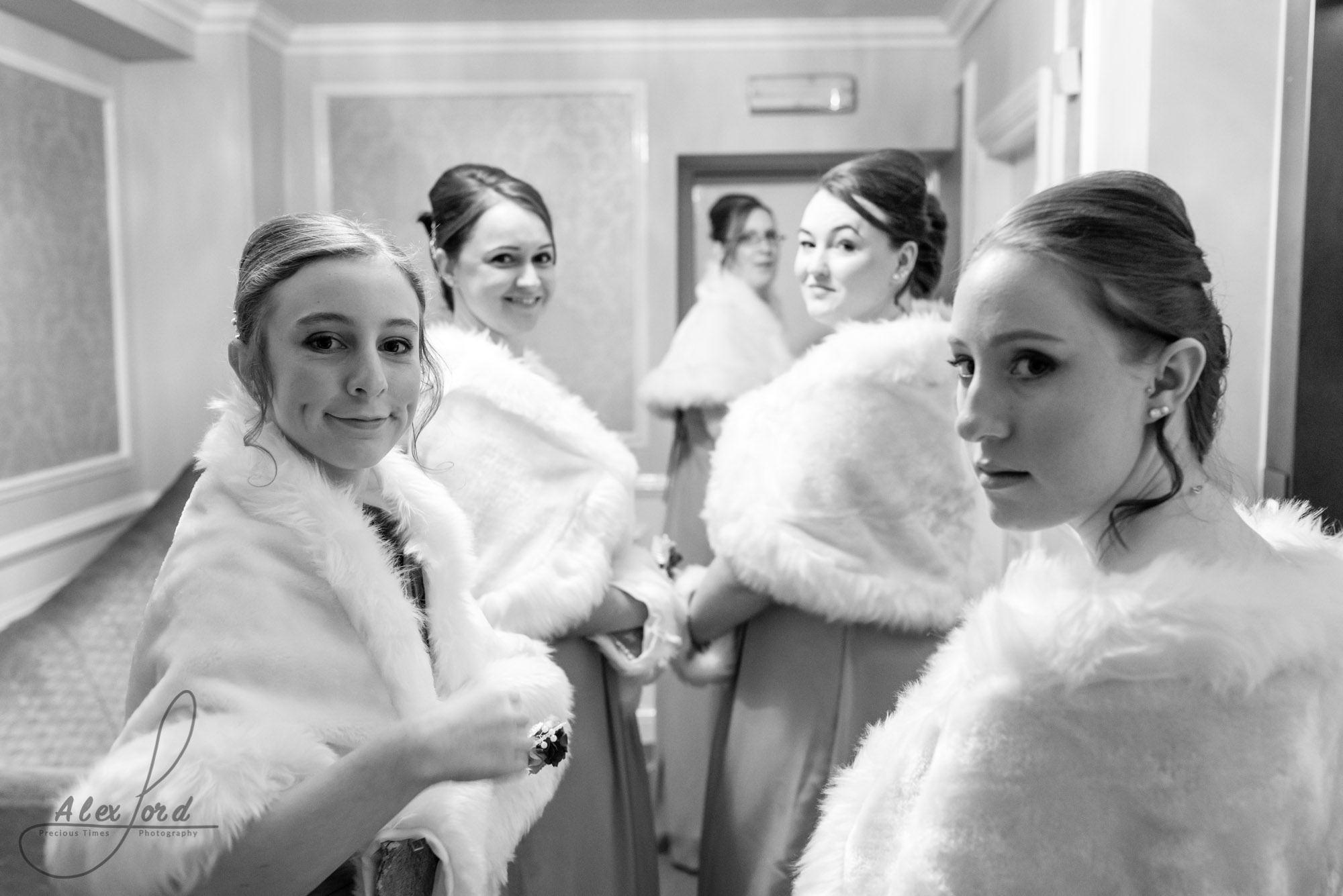 bridemaids gather in the hallway outside the wedding ceremony room