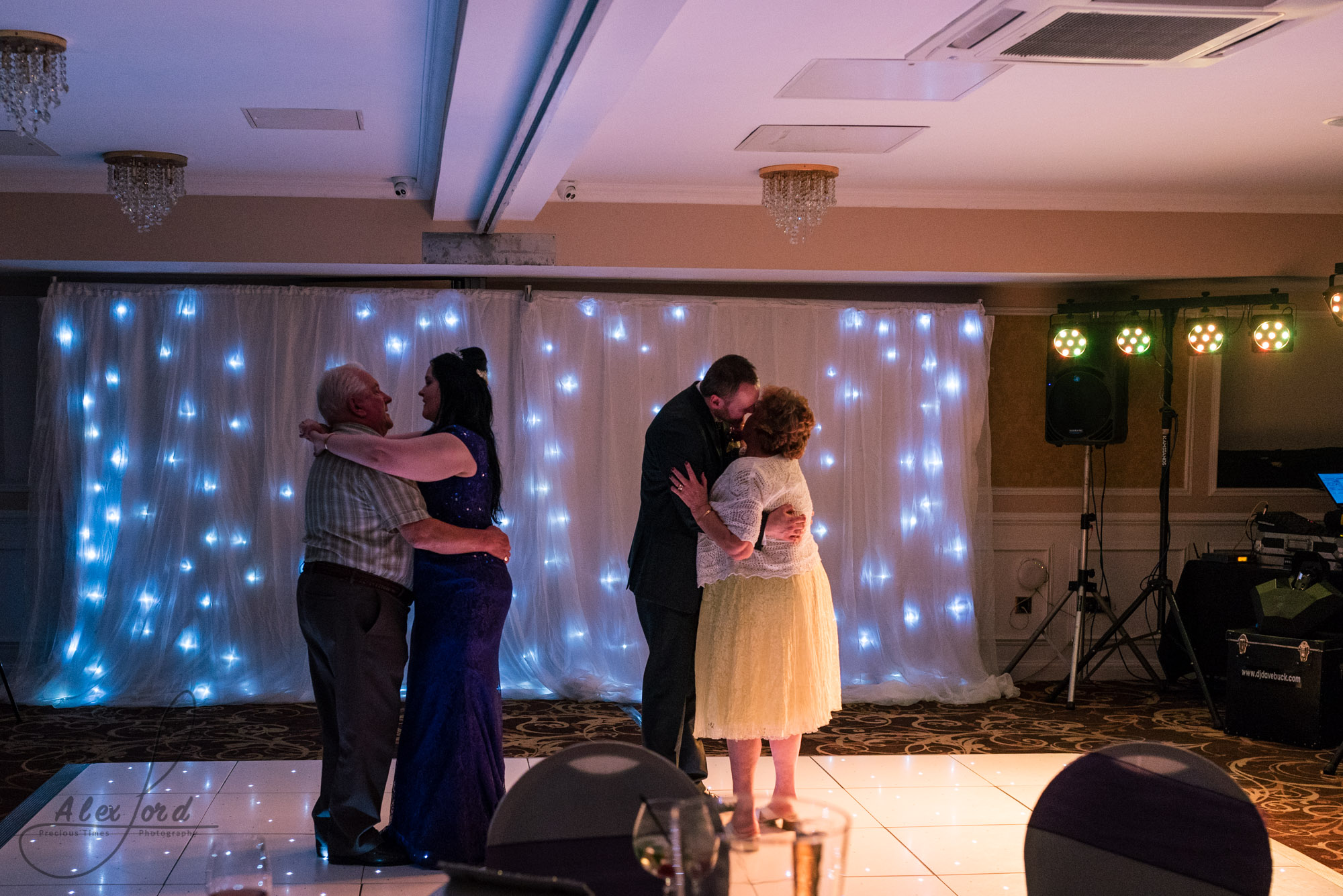 guests join the bride and groom on the dance floor after their first dance