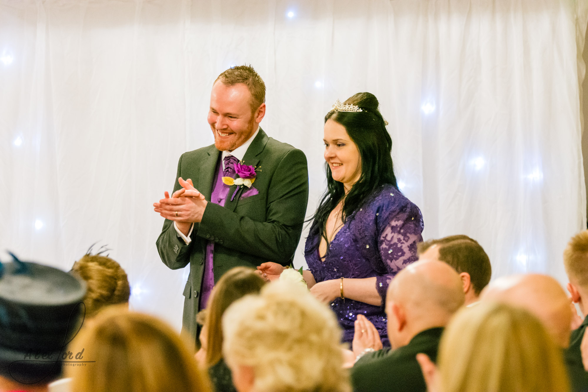 the bride and groom stand together to hear the end of the wedding ceremony