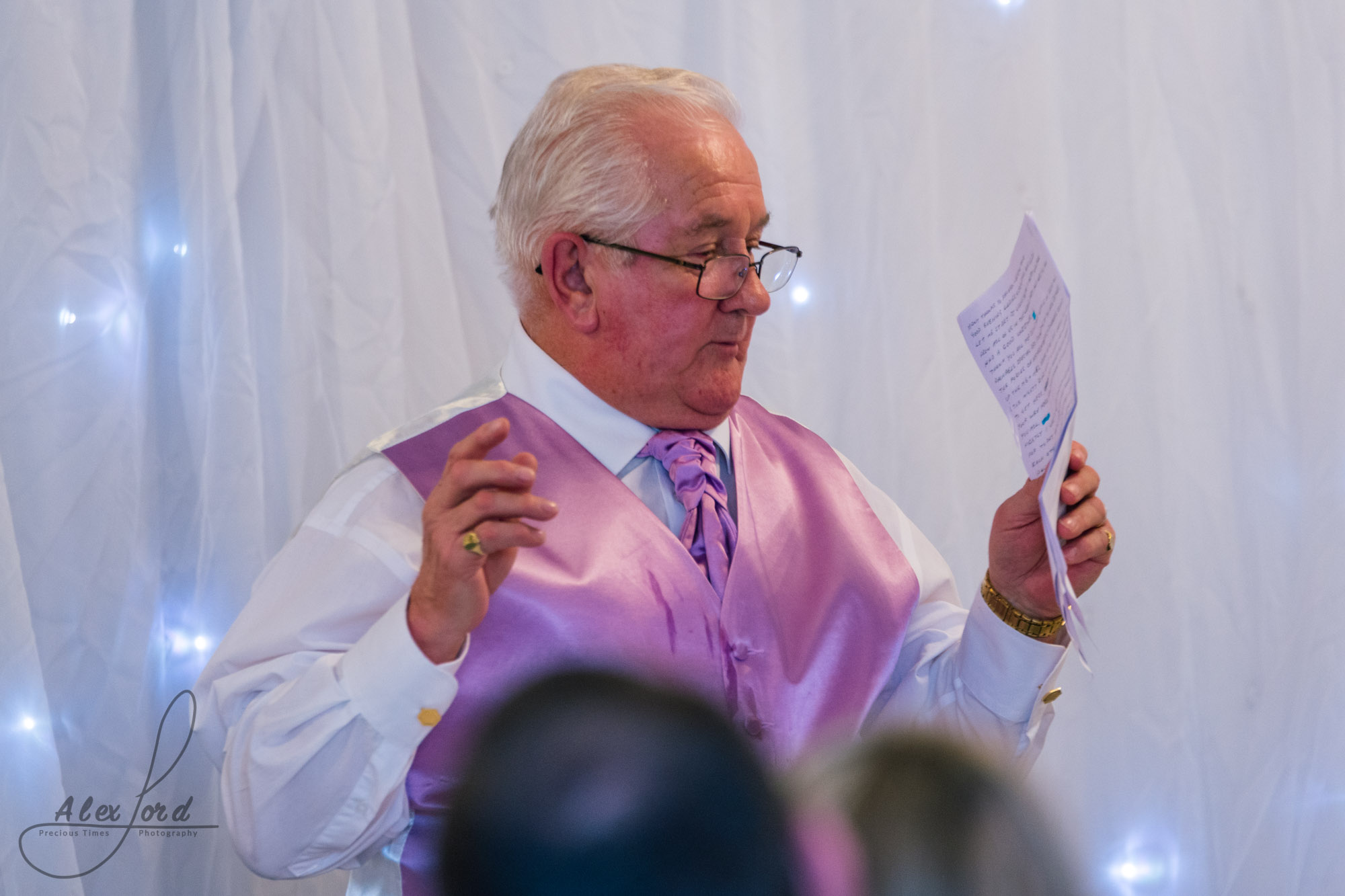 the father of the bride starts his speak at the beginning of the wedding breakfast