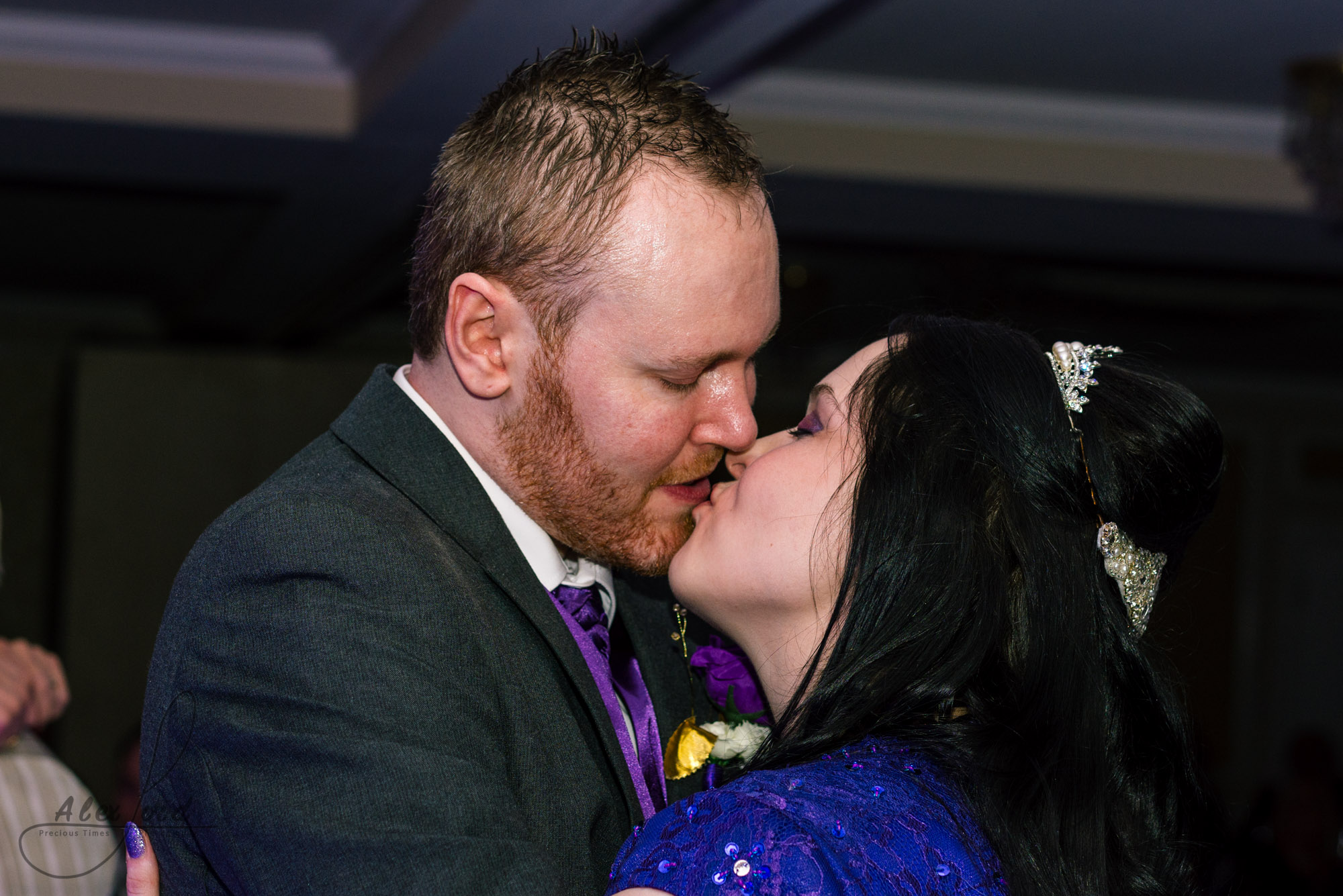 the bride and groom have a kiss during their first dance